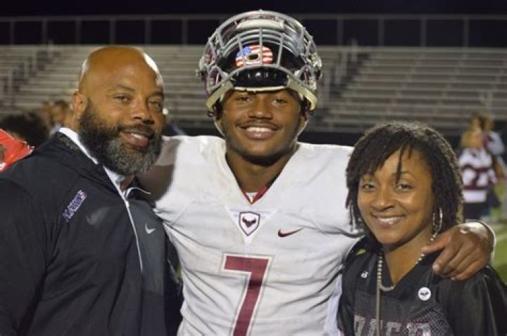 Andre with his mom, dad, and brother