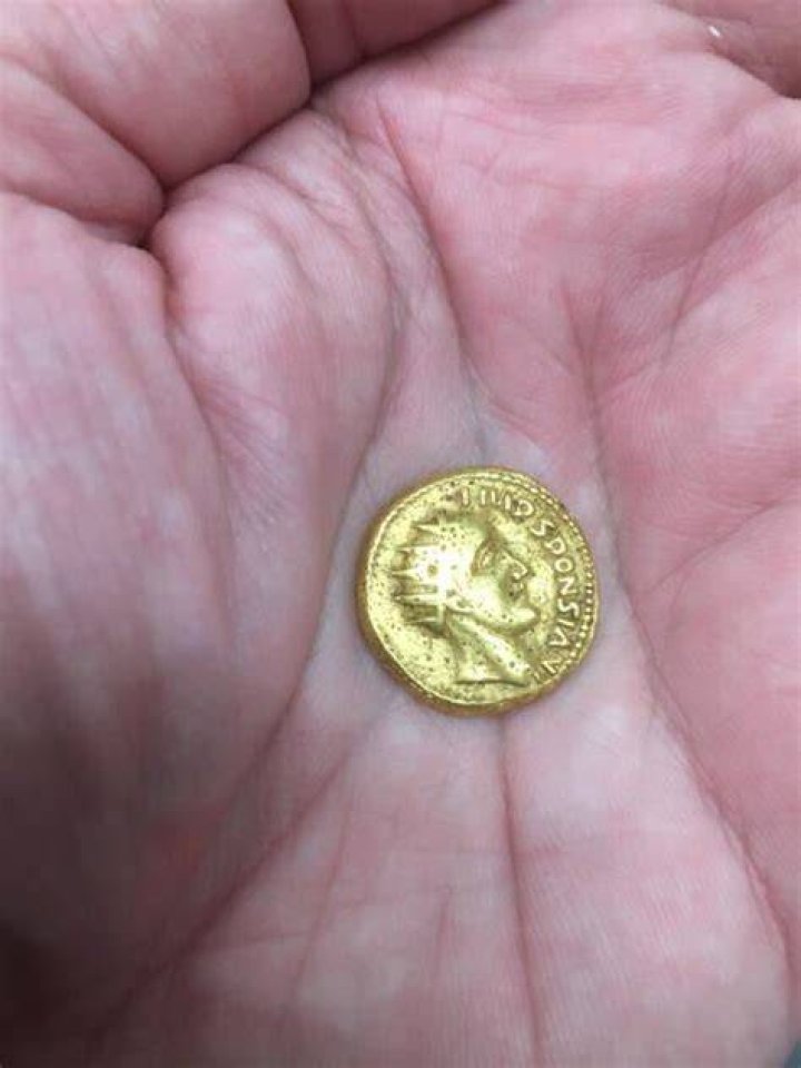 Holding The Sponsian Coin