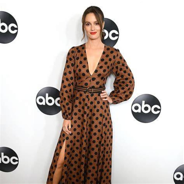 Leighton Meester Wears Silk Flowered Dress and Giggles As Husband Adam Brody Whispers in Her Ear on Red Carpet